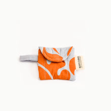 Load image into Gallery viewer, A collection of puffy AirPod cases in various designs and colors, displayed alongside a pair of AirPods.