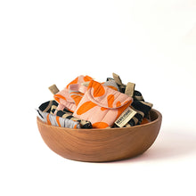 Load image into Gallery viewer, A collection of puffy AirPod cases in various designs and colors, displayed alongside a pair of AirPods.