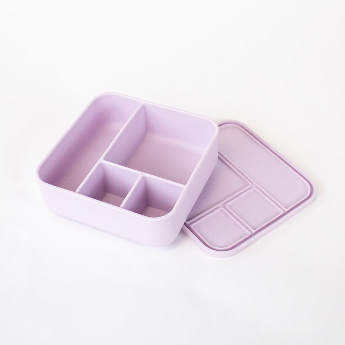 Purple divided storage container on a white background