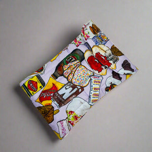 Product photo of fabric laptop case. Bright coloured print of Iconic Australian foods