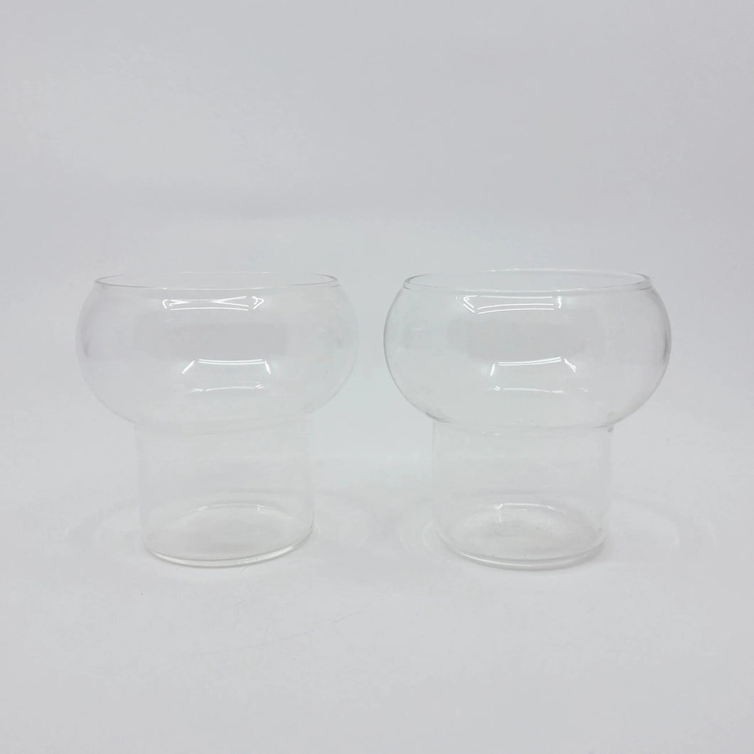 product photo of two glass cups. with a rounded bulb top and cylindrical bottom 