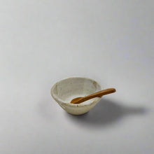 이미지를 갤러리 뷰어에 로드 , Product photo of a miniature wooden spoon, sitting in a small ceramic bowl resting against the edge. 
