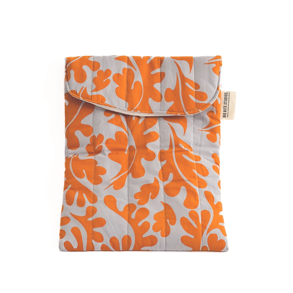 Product photo of fabric laptop pouch, light grey with bright orange abstract print