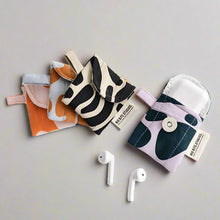 Charger l&#39;image dans la galerie, product photo of fabric airpods case. four cases in different abstract, colourful patterns.
